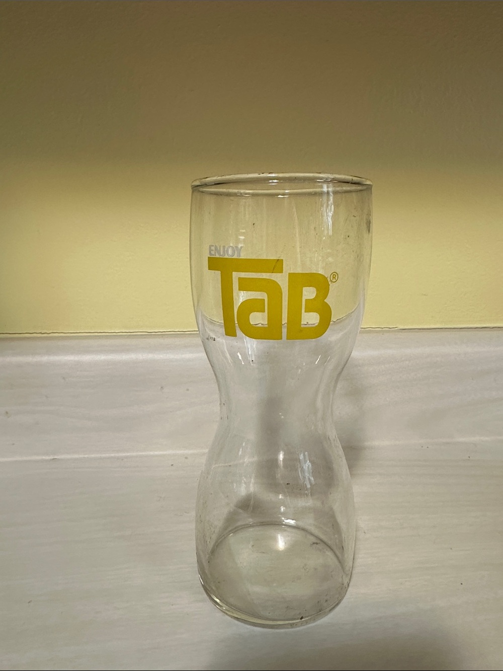 TAB Branded Clear Glass Carafe with Yellow Logo